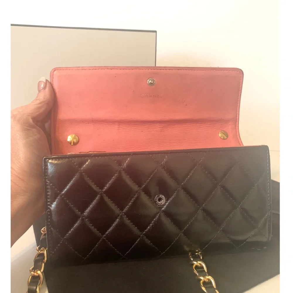 CHANEL Black Quilted Lambskin Crossbody with Gold Chain & Tassel Accent
